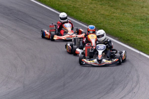 3 karts racing around bend