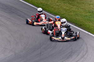 3 karts racing around bend